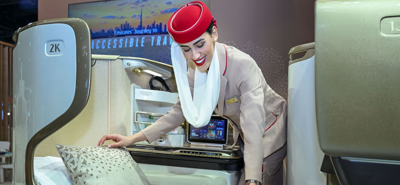 Image: Emirates flight attendant adjusts accessible mattress (Photo Credit: Courtesy Emirates)