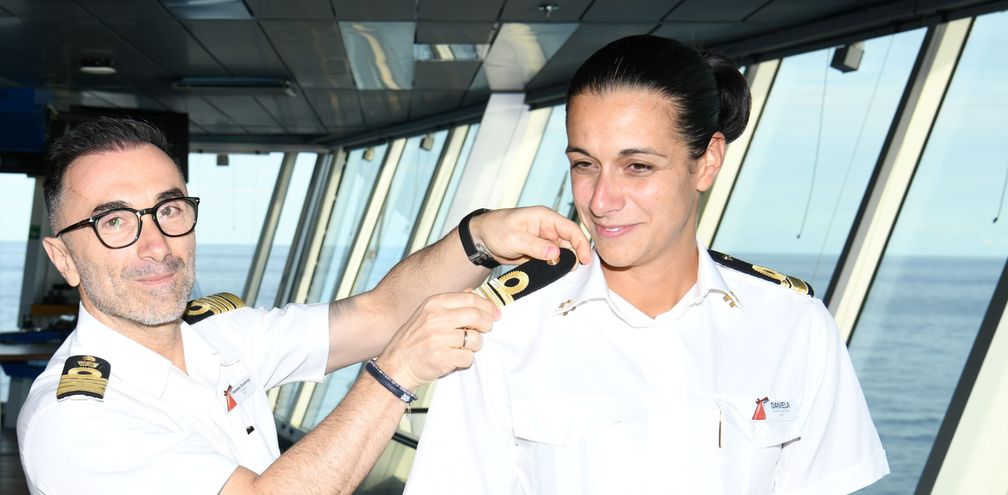 Captain Francesco Bencivenga places the epaulettes on Daniela Gargiulo