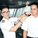 Captain Francesco Bencivenga places the epaulettes on Daniela Gargiulo