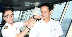 Captain Francesco Bencivenga places the epaulettes on Daniela Gargiulo
