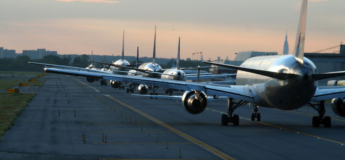 Image: Planes on runway at New York's JFK airport. (photo via XavierMarchant / iStock / Getty Images Plus)