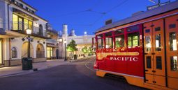 Red Trolley Car driving down streets in Disney California Adventure