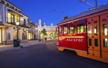 Red Trolley Car driving down streets in Disney California Adventure
