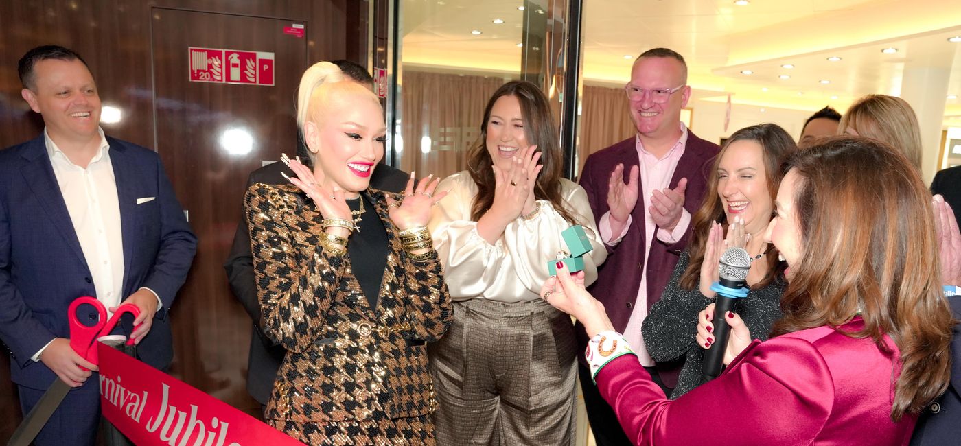 Image: Christine Duffy presents Gwen Stefani with her godmother gift, an EFFY Legacy panther ring. (Photo Credit: Carnival Cruise Line Media)