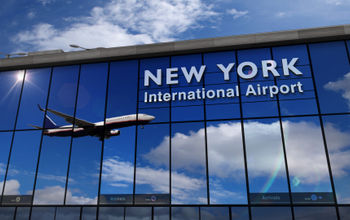 Reflection of airplane landing at New York's JFK International Airport.