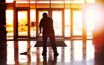 Janitor cleaning a hotel lobby