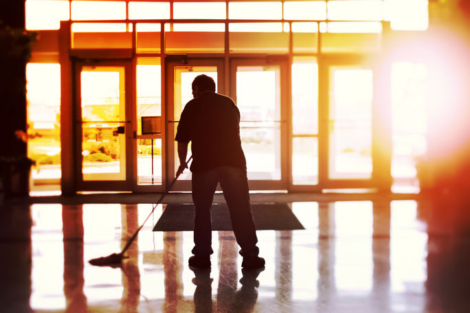 Janitor cleaning a hotel lobby