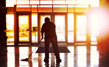 Janitor cleaning a hotel lobby