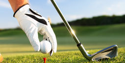 Golfer teeing up a ball
