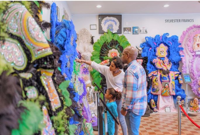 Family visiting the Backstreet Cultural Museum in New Orleans