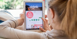 Woman browsing Airbnb listings