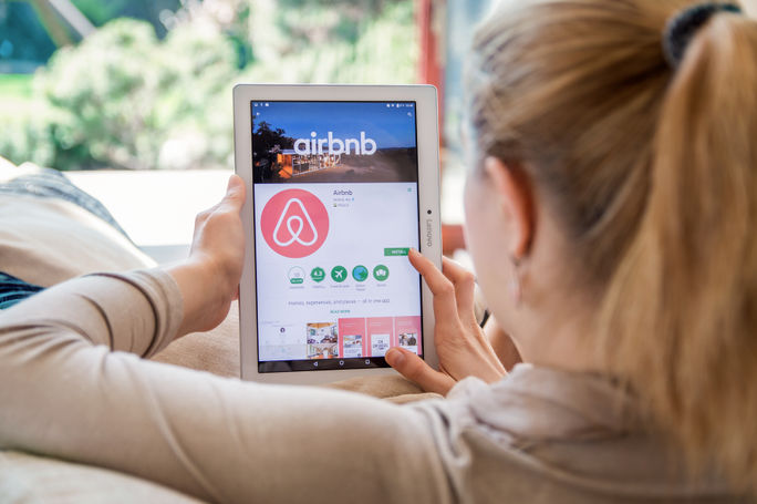 Woman browsing Airbnb listings Woman browsing Airbnb listings