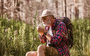 Hiker sparking a joint