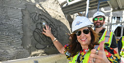 Christine Duffy and Josh Weinstein lay commemorative keys in the Celebration Key Suncastle