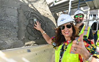 Christine Duffy and Josh Weinstein lay commemorative keys in the Celebration Key Suncastle