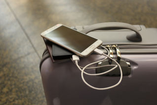 Power bank on luggage
