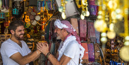 A shop vendor and visitor in Amman, Jordan