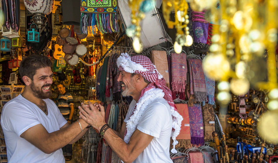 A shop vendor and visitor in Amman, Jordan