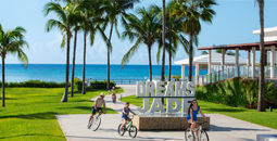 A family biking at Dreams Jade Resort & Spa