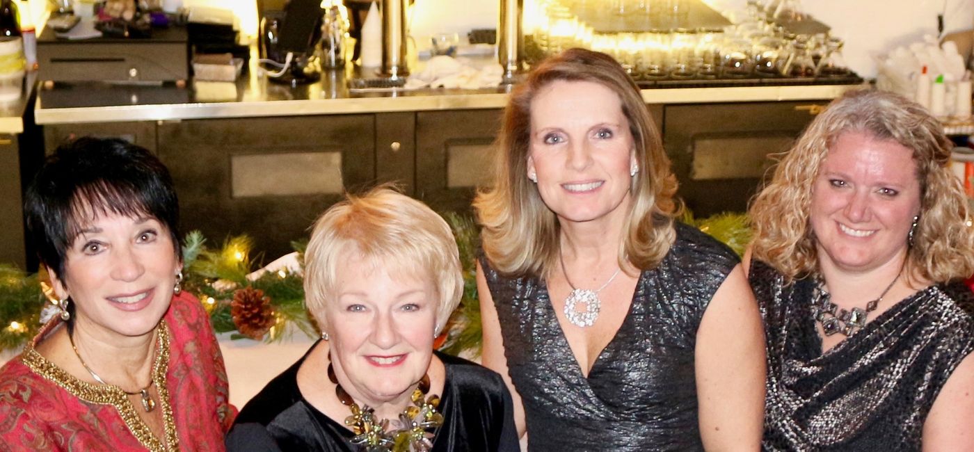 Image: The Executive Team for Travel Experts includes (left to right): Susan Ferrell, Owner and President, Sharon Fake, Executive Director, Claire Canady, Director North Carolina Operations, Heather McIntyre, Director Technology & Finance. (Photo Credit: Travel Experts)