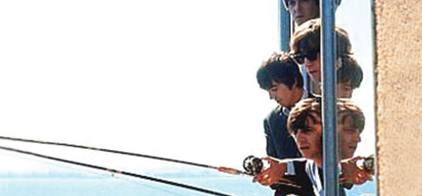 Image: The Beatles fishing out the window of The Edgewater Hotel in Seattle in 1964 (Photo Credit: The Edgewater Hotel)