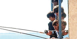 The Beatles fishing out the window of The Edgewater Hotel in Seattle in 1964