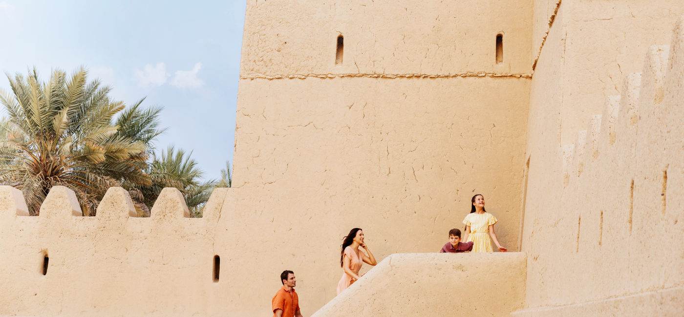 Image: Family Exploring Qasr Al Muwaiji (Photo Credit: © Department of Culture and Tourism, Abu Dhabi)