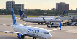 United Airlines planes taxiing on an airport tarmac.