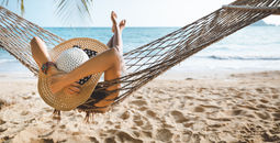 Summer traveler relaxing on the beach