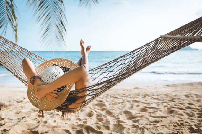 Summer traveler relaxing on the beach Summer traveler relaxing on the beach