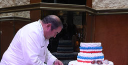 Emeril Lagasse cut the cake for Carnival's anniversary celebration in New Orleans