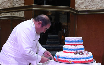 Emeril Lagasse cut the cake for Carnival's anniversary celebration in New Orleans