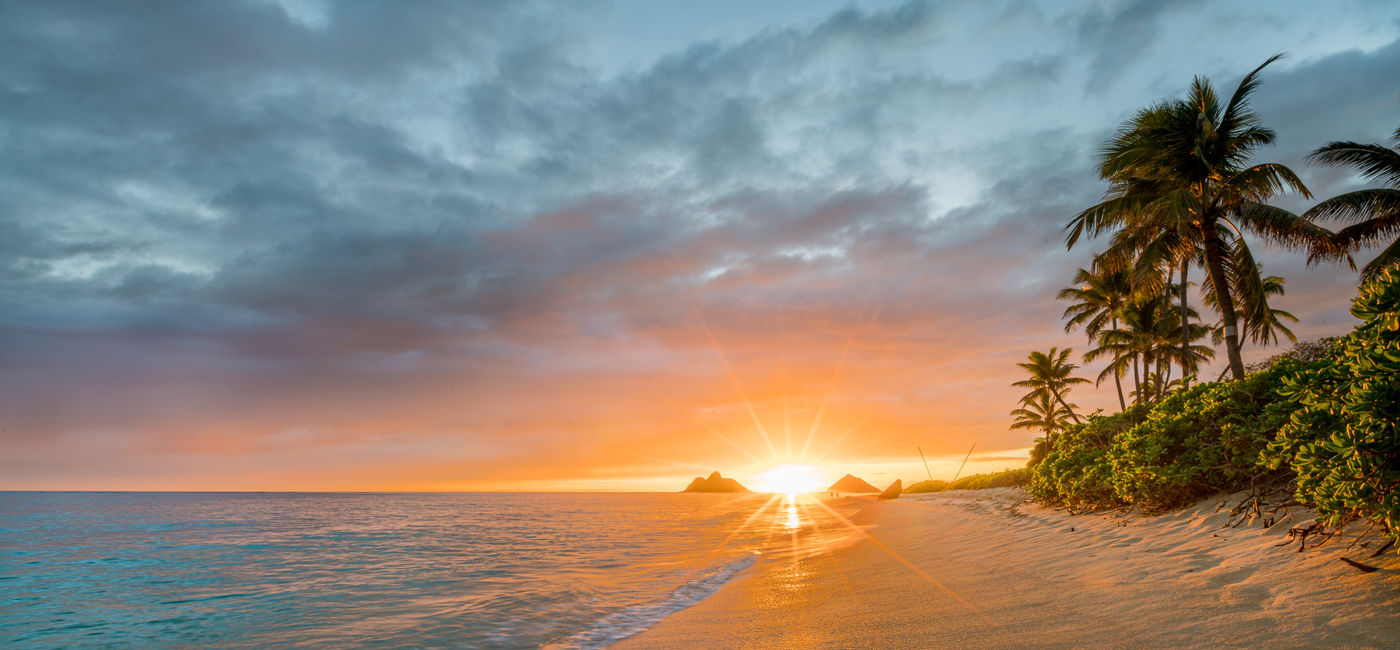 Image: A sunrise on Lanikai Beach, Oahu, Hawai'i. (Source: Adobe Stock / RonPaulk Photography)
