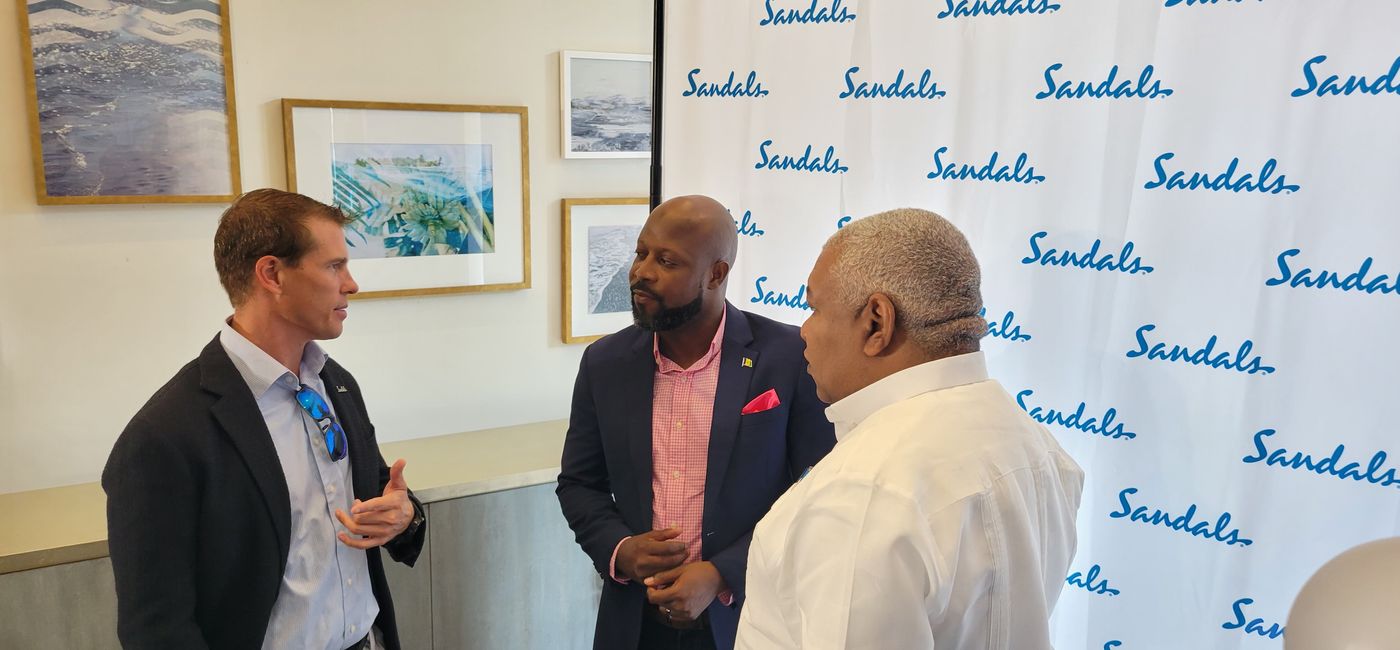 Image: Carlos James, St. Vincent tourism minister (center) with Adam Stewart (left) and Gary Sadler of Sandals Resorts International. (Photo by Brian Major)