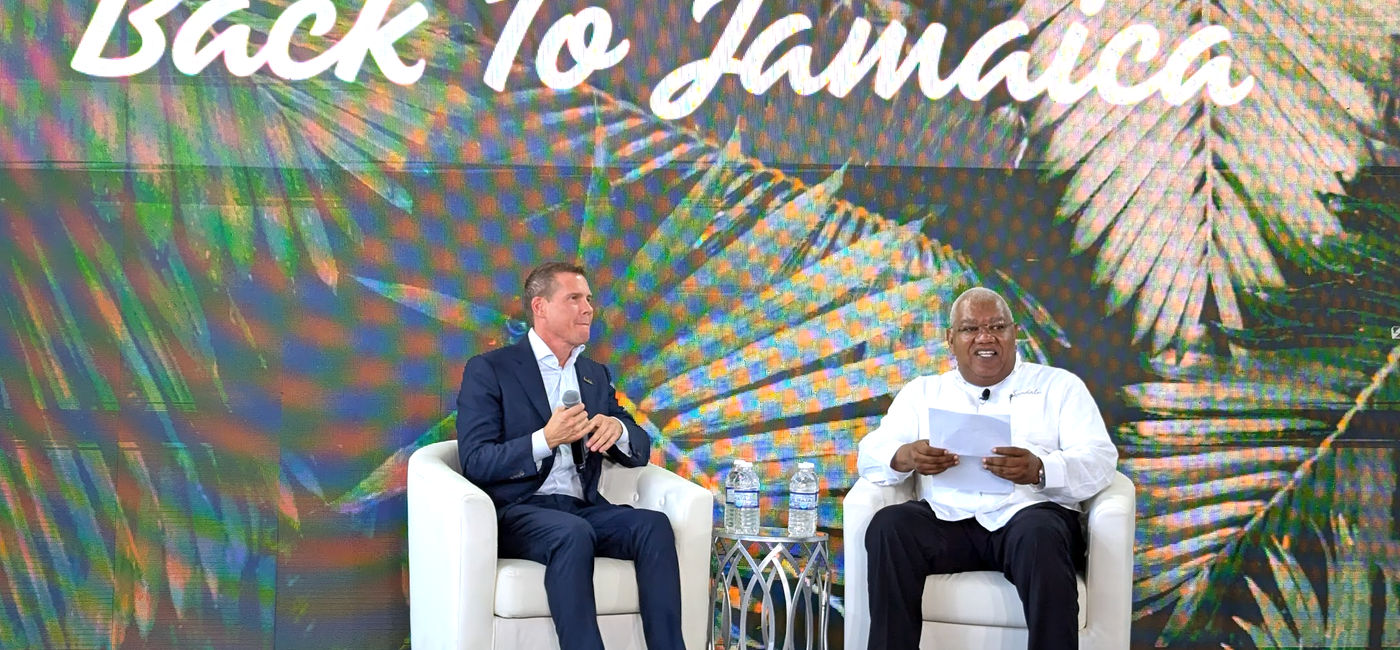 Image: Adam Stewart and Gary C. Sadler on stage at Sandals Resorts' Back to Jamaica event (Photo Credit: Eric Bowman)