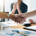 Executives celebrating a business acquisition
