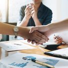 Executives celebrating a business acquisition