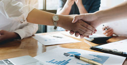 Executives celebrating a business acquisition