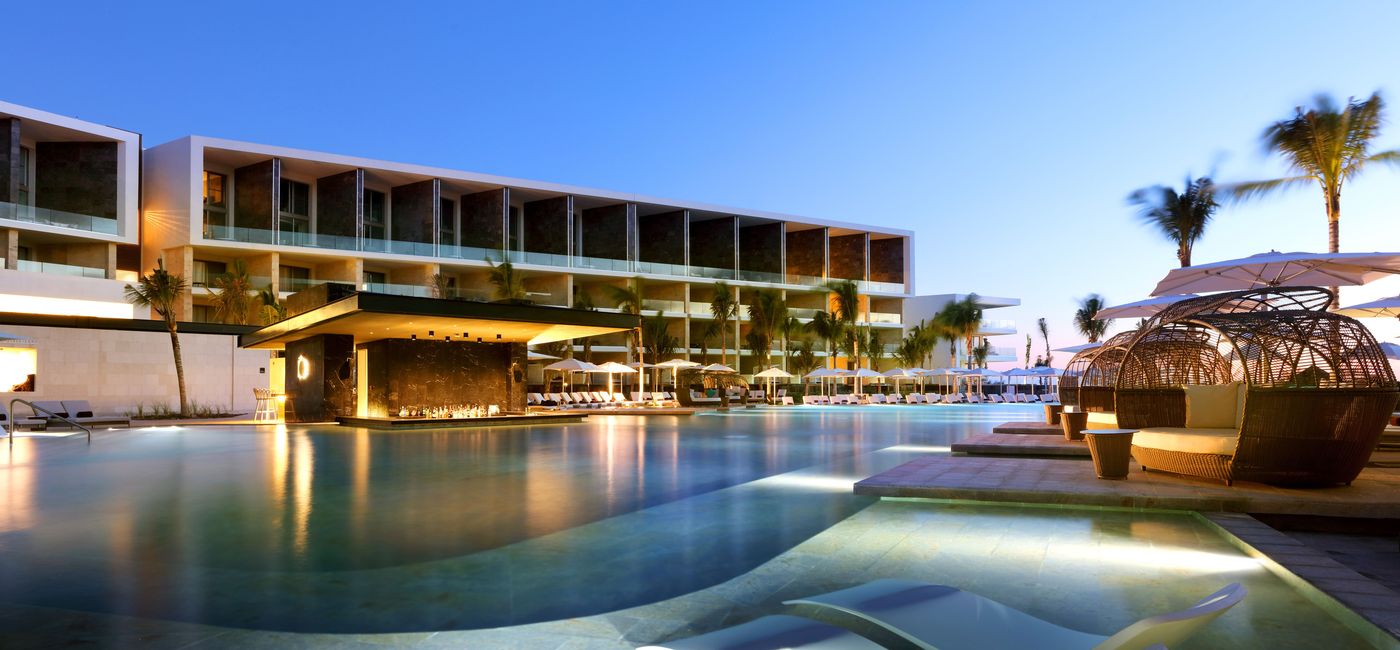 Image: TRS Coral Hotel pool at night.  (Photo Credit: Palladium Hotel Group)