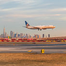 United Airlines jet landing at Newark Liberty International Airport.