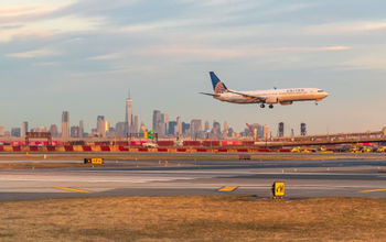 United Airlines jet landing at Newark Liberty International Airport.