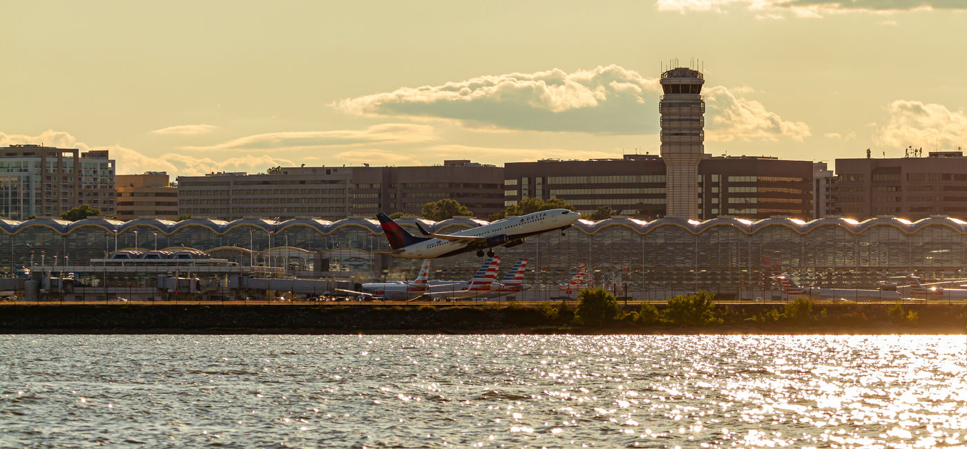 Image: Plane taking off from Ronald Reagan Washington National Airport. (Photo Credit: Adobe/Grandbrothers)