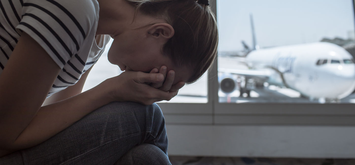 Image: Stressed out traveler at the airport. (Photo Credit: kieferpix/Adobe)