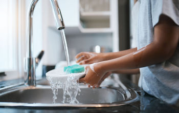 Woman cleaning dishes