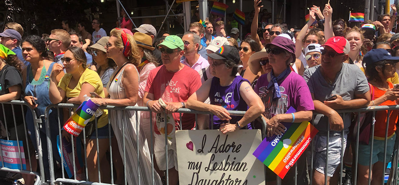 Image: Attendees watch the New York City Pride Parade in 2019. (Photo by Paul Heney.)