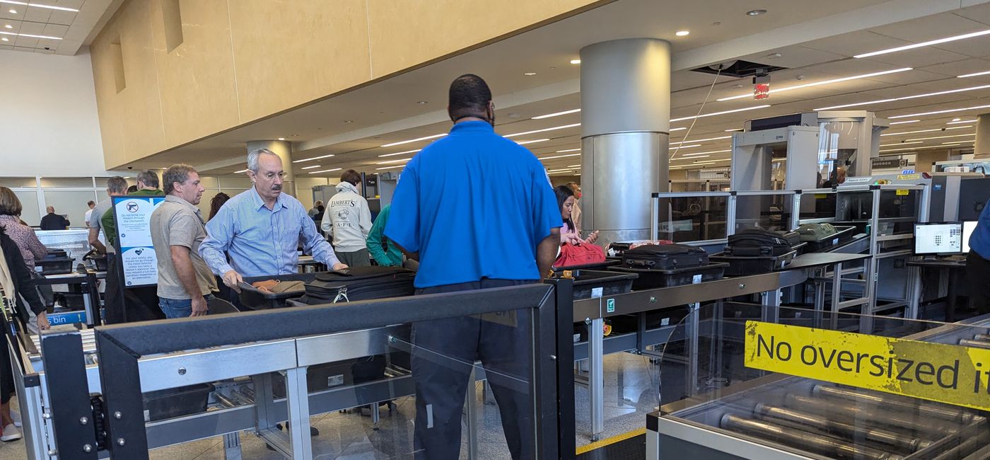Image: Travelers go through TSA security (Photo Credit: Eric Bowman)