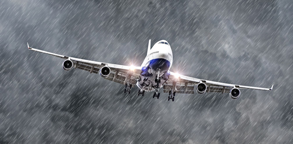 Passenger airplane flying through a storm.