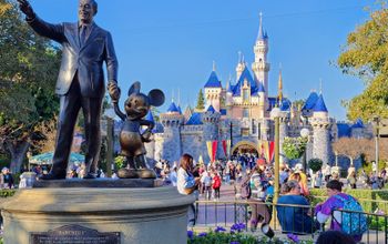 Sleeping Beauty Castle with the "Partners" statue in the foreground at Disneyland Resort, Anaheim, California.