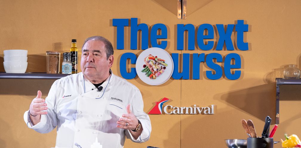 Chief Culinary Officer Emeril Lagasse puts on a cooking demo showcasing one of Carnival's culinary creations