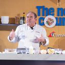 Chief Culinary Officer Emeril Lagasse puts on a cooking demo showcasing one of Carnival's culinary creations